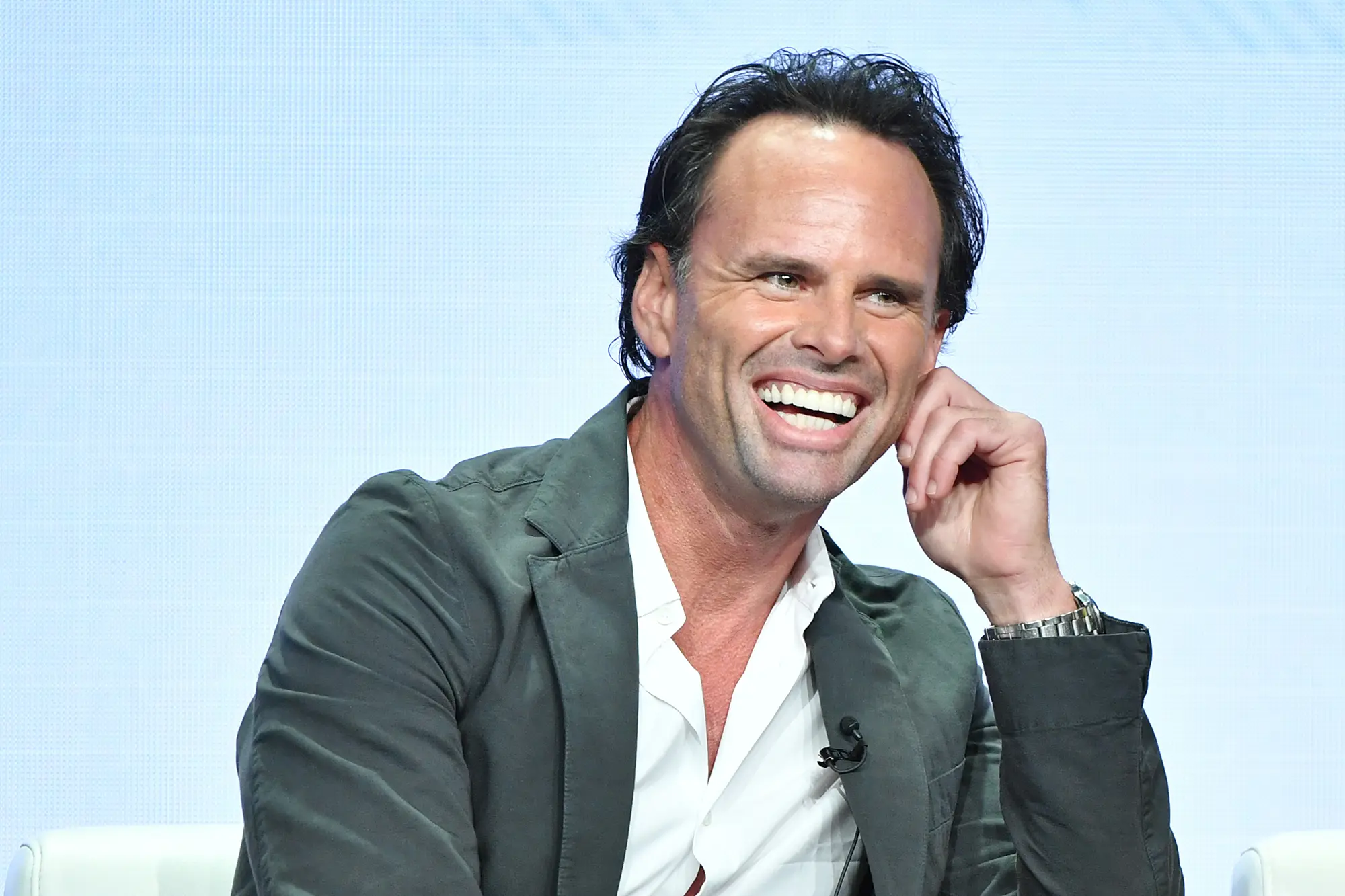 Close-up of Walton Goggins smiling with clean, slightly polished teeth, sparking speculation about veneers despite the natural look of his dental appearance.